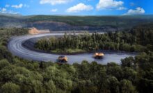 Грузовые автомобили везут уголь из карьера